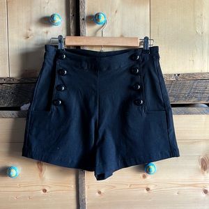 Cute as a button black high waisted embroidered shorts by Voodoo Vixen.